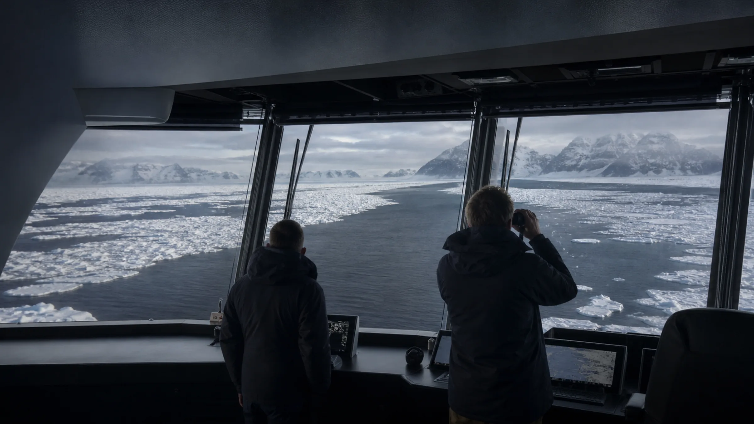 Bridge watchkeepers observing a lead through sea ice
