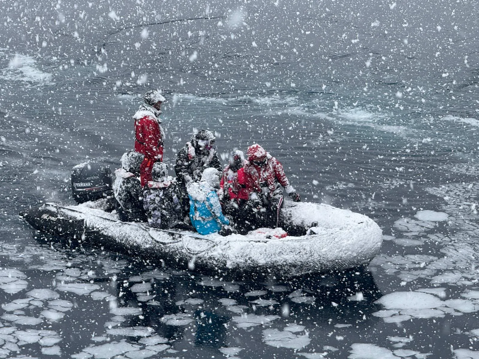 A zodiac in snow and ice on the Antarctic Peninsula